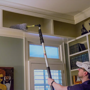 Hinge tip in action cleaning a tall bookshelf