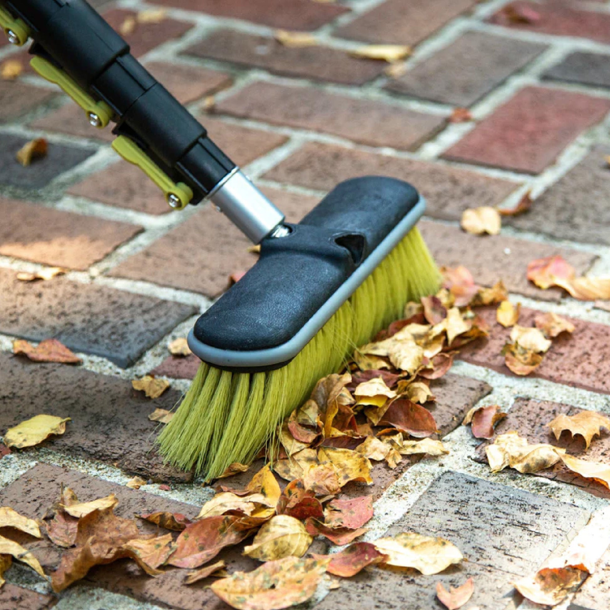 medium bristle brush sweeping brick